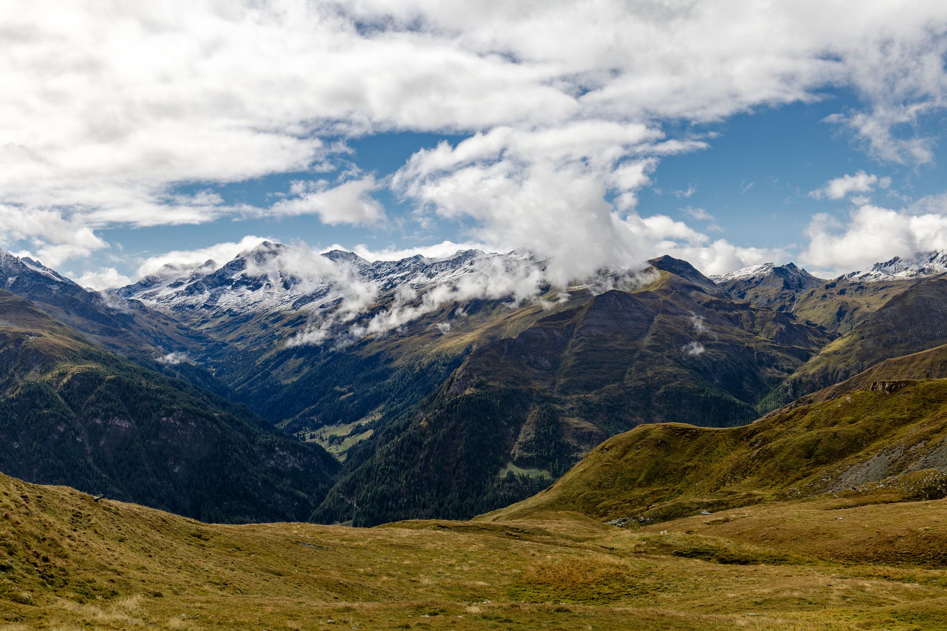 Alpine mountain refuge under dramatic cloudy sky