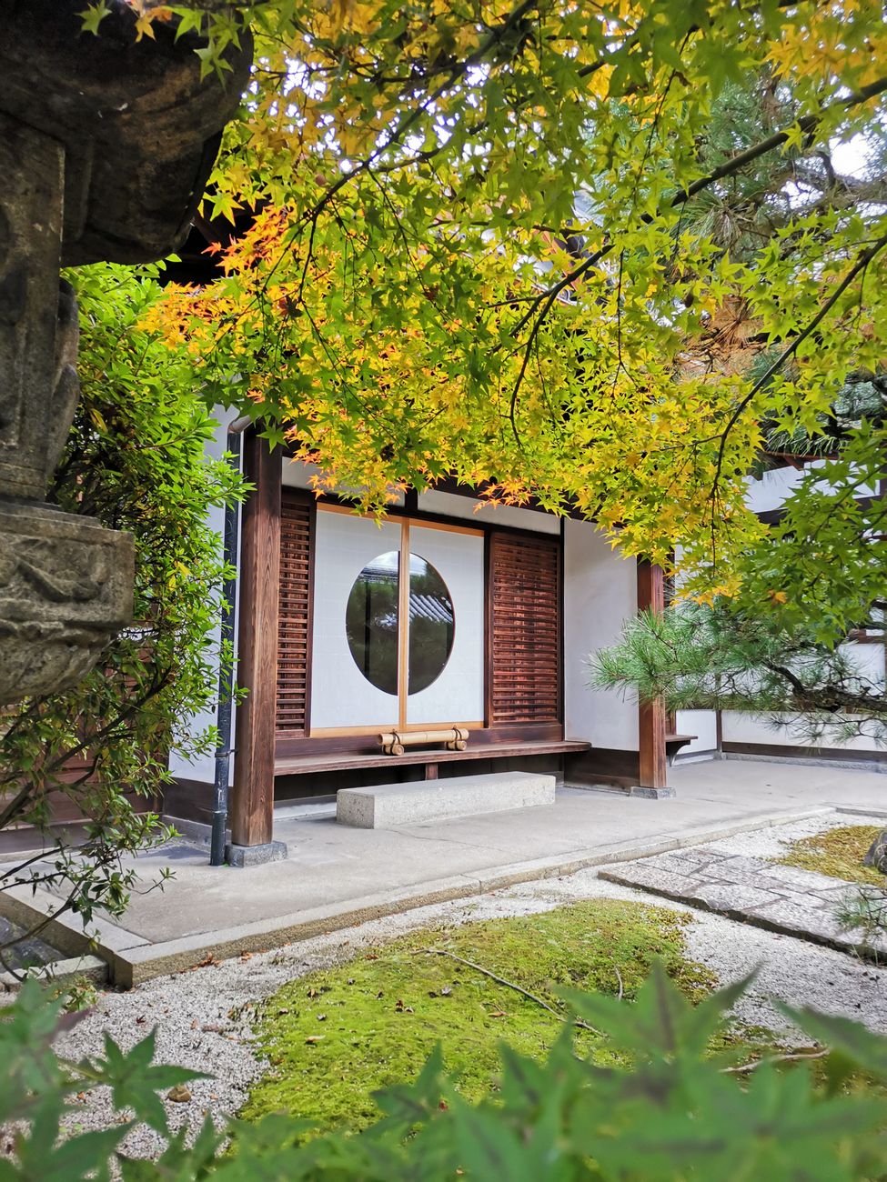 Quiet wooden temple garden in Kyoto during late autumn